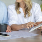A couple trying to reduce studying their finances to debt